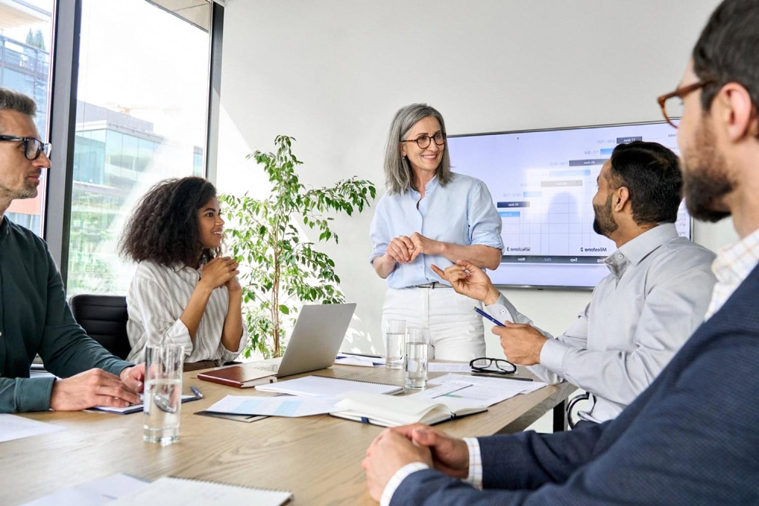 UAE company management team discussing beneficial ownership records in a boardroom